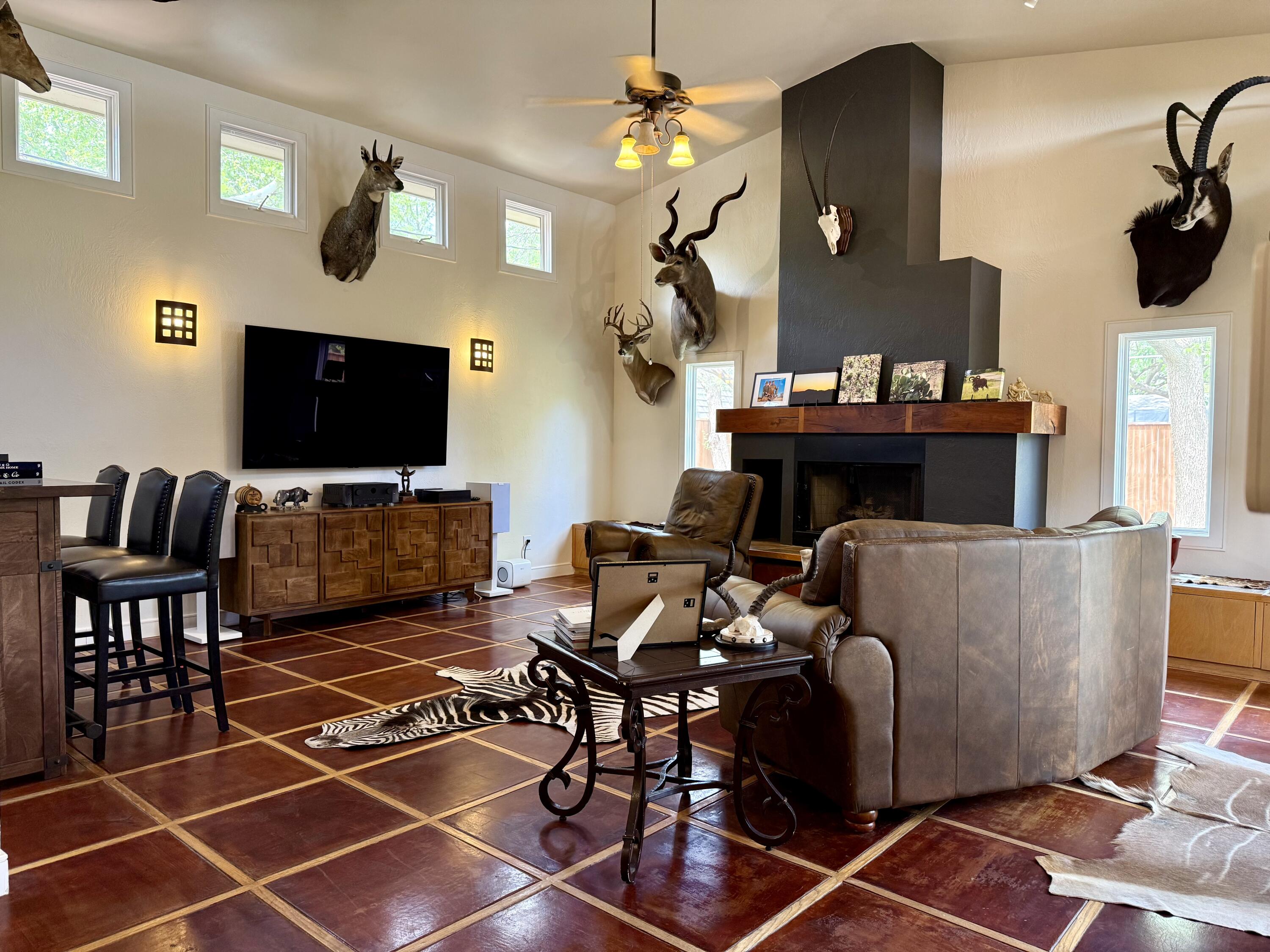 4406 15th Street Lubbock, TX 79416 - Photo 18 of 61 a living room with furniture and a flat screen tv