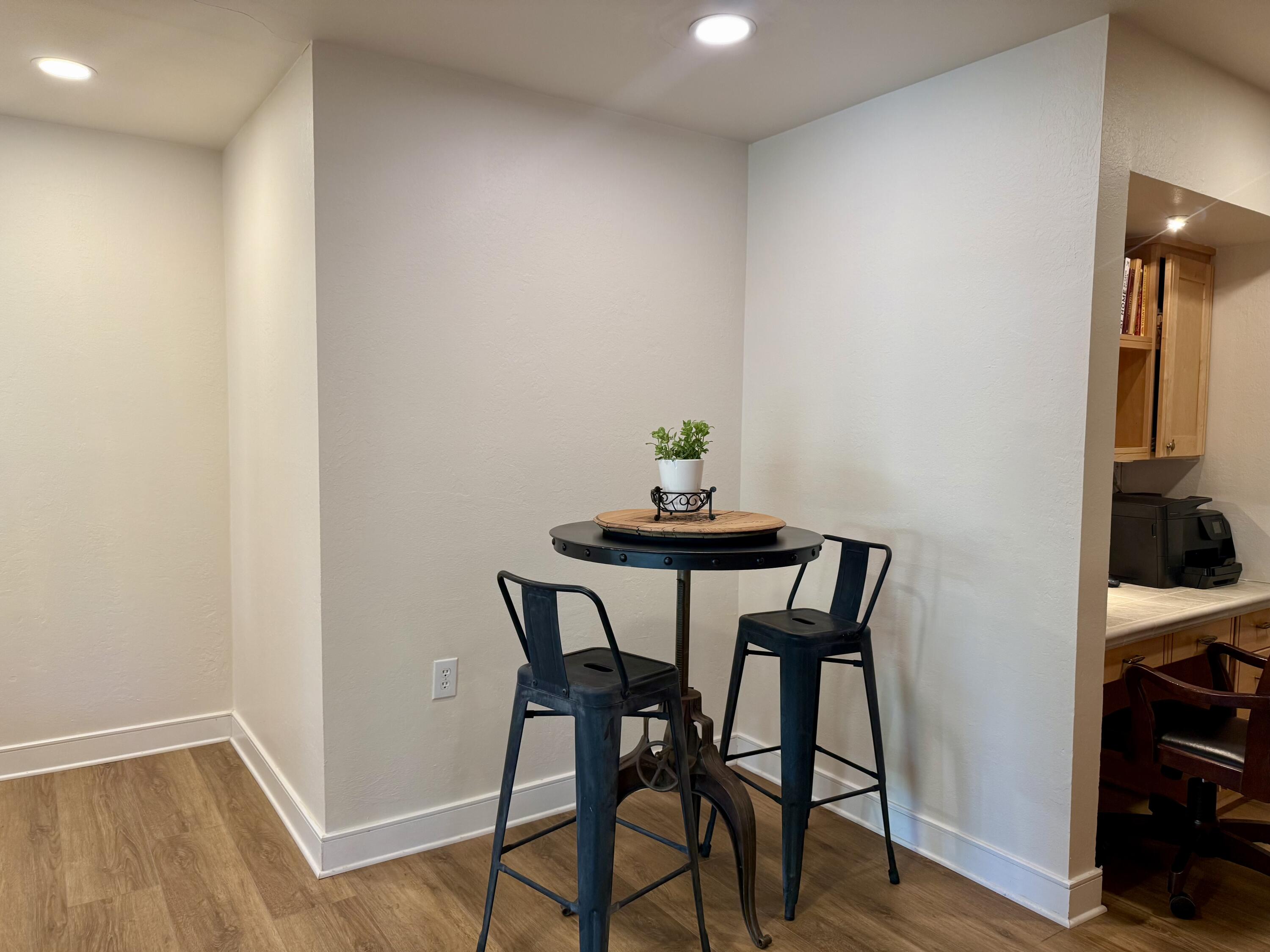 4406 15th Street Lubbock, TX 79416 - Photo 26 of 61 a view of a dining room with furniture and wooden floor