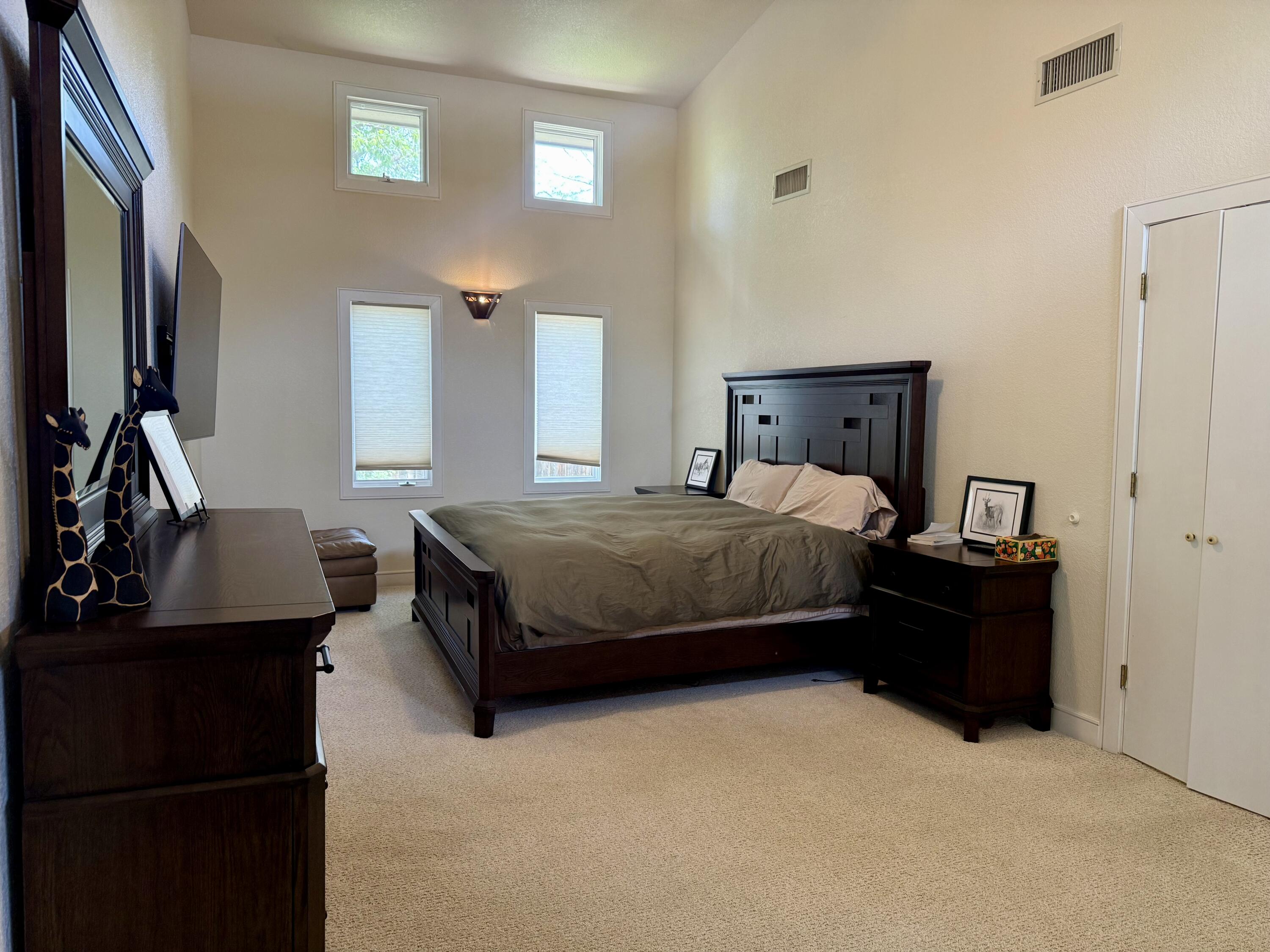4406 15th Street Lubbock, TX 79416 - Photo 27 of 61 a bedroom with a bed and a dresser