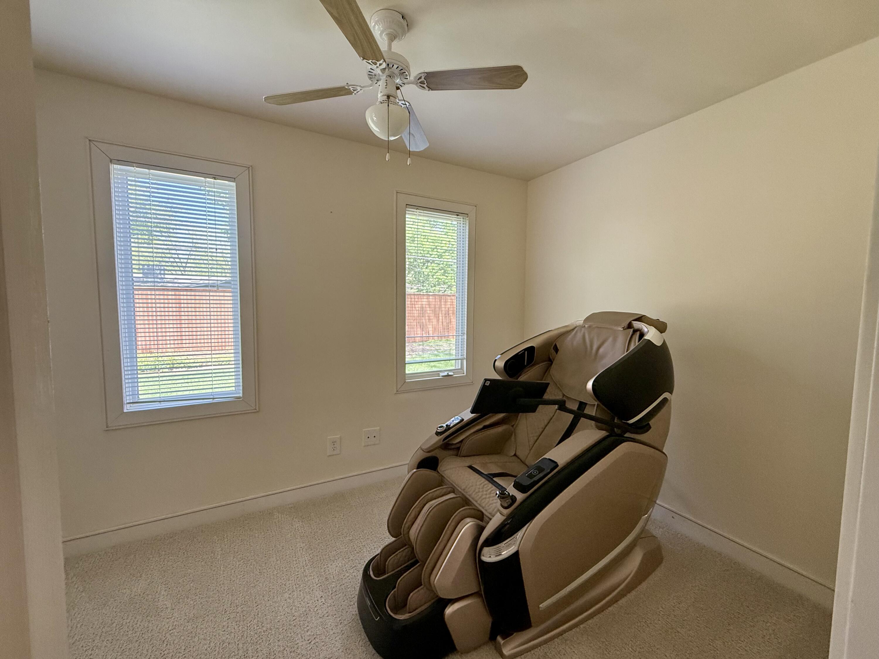 4406 15th Street Lubbock, TX 79416 - Photo 29 of 61 a room with gym equipment and windows