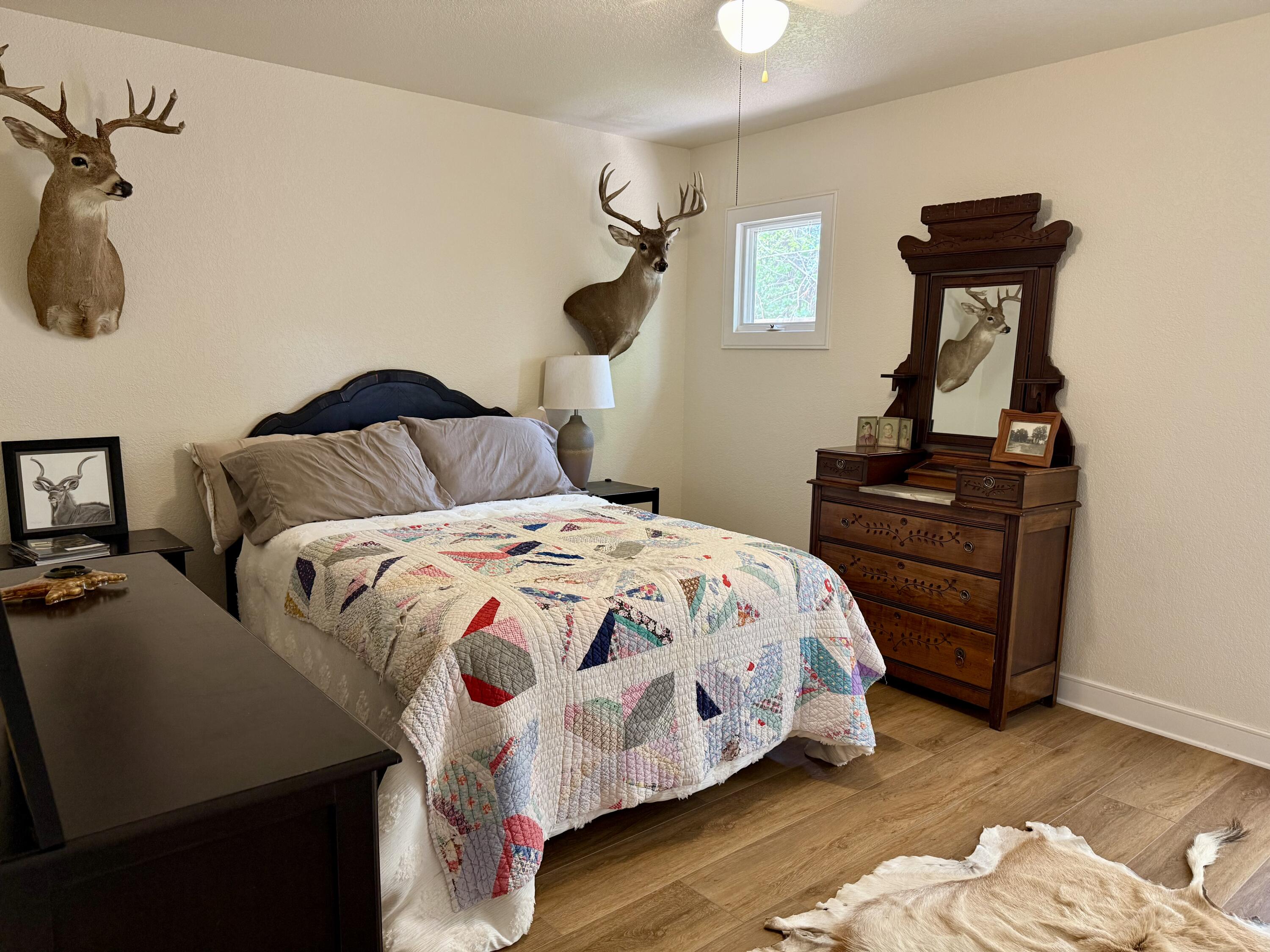 4406 15th Street Lubbock, TX 79416 - Photo 33 of 61 a bedroom with a bed and a dresser