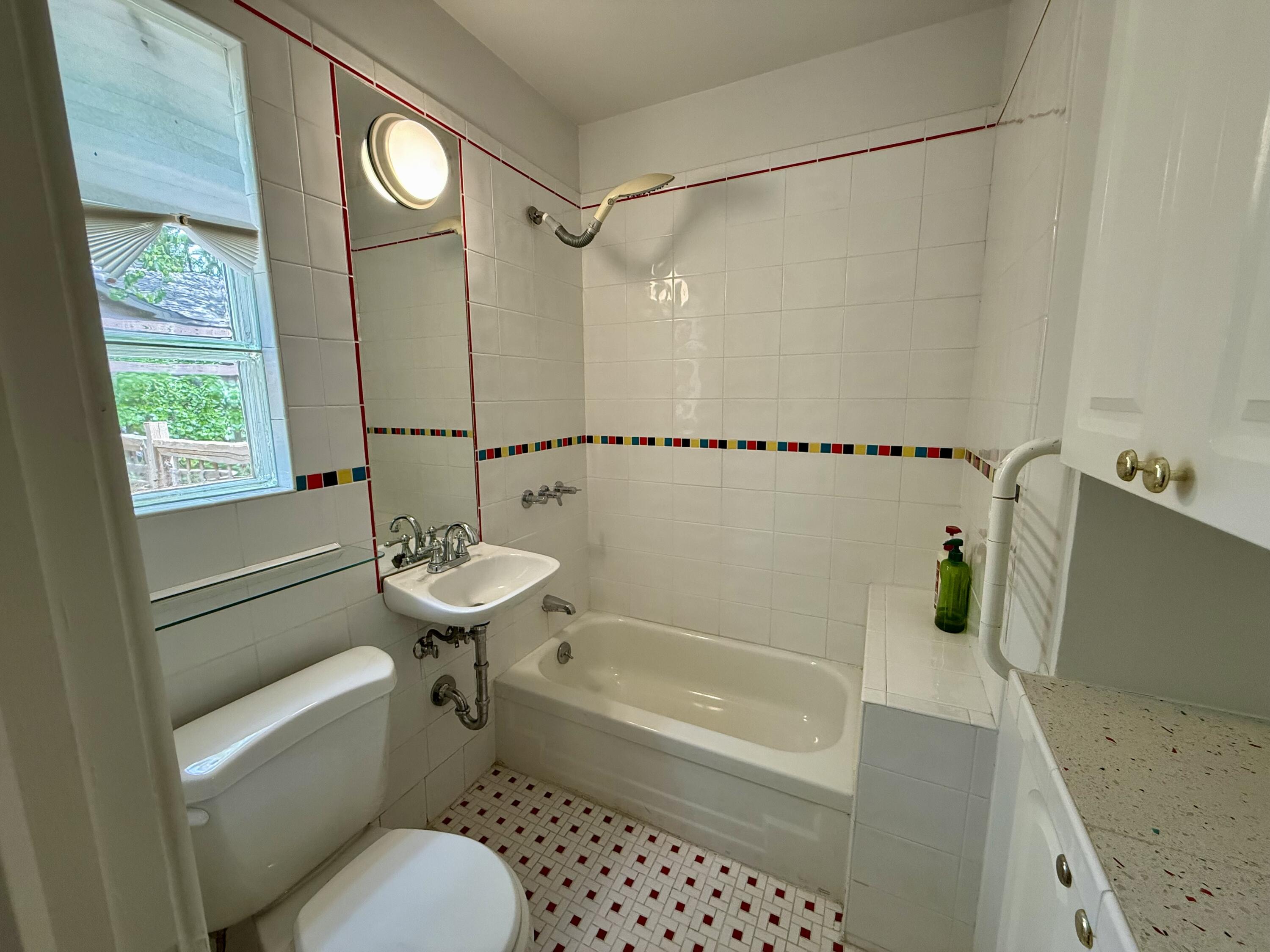 4406 15th Street Lubbock, TX 79416 - Photo 35 of 61 a bathroom with a sink toilet and shower