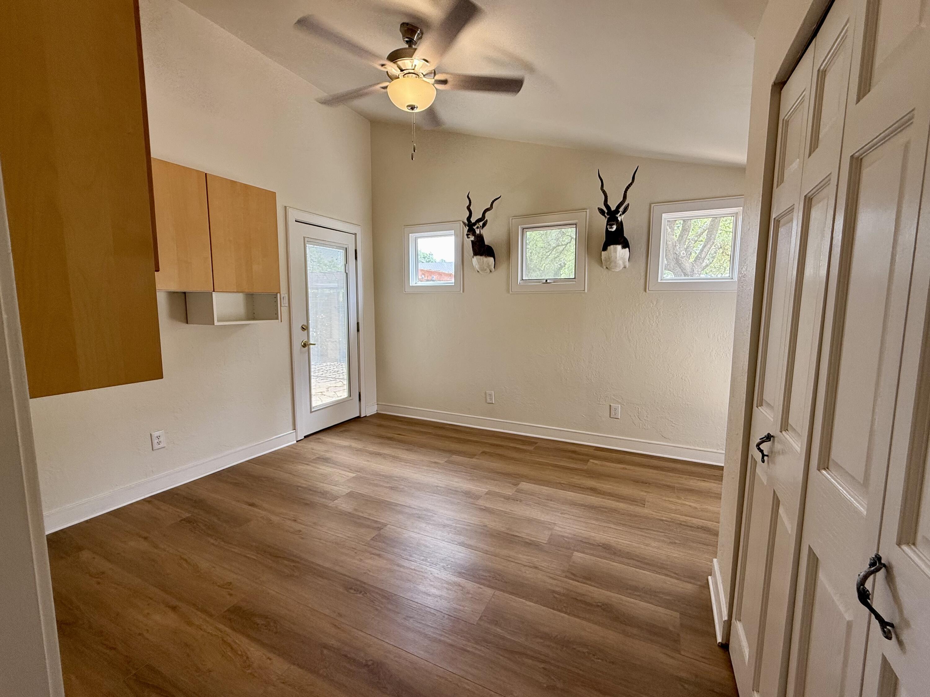 4406 15th Street Lubbock, TX 79416 - Photo 43 of 61 a view of empty room with wooden floor and fan