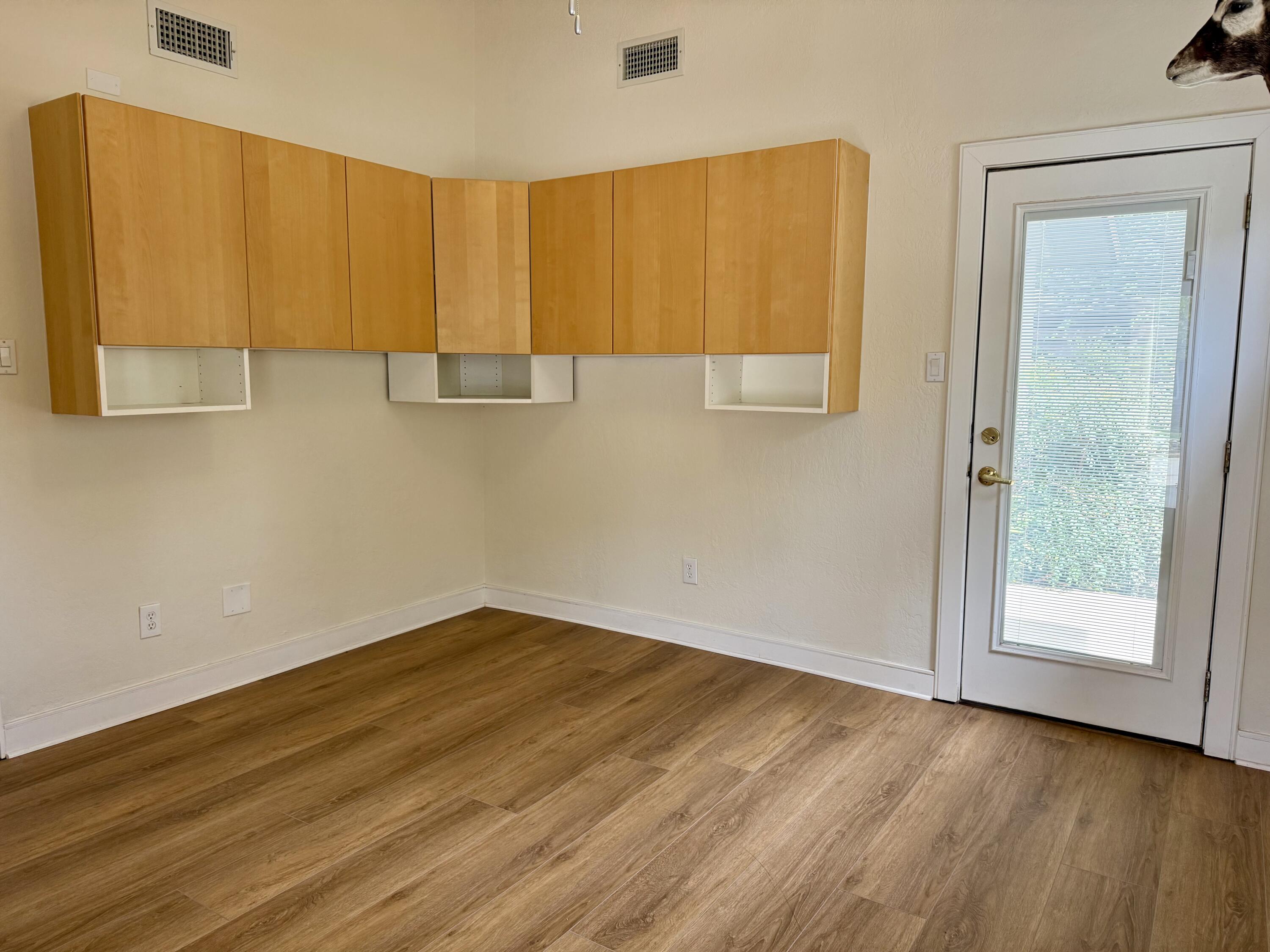 4406 15th Street Lubbock, TX 79416 - Photo 44 of 61 an empty room with wooden floor and closet