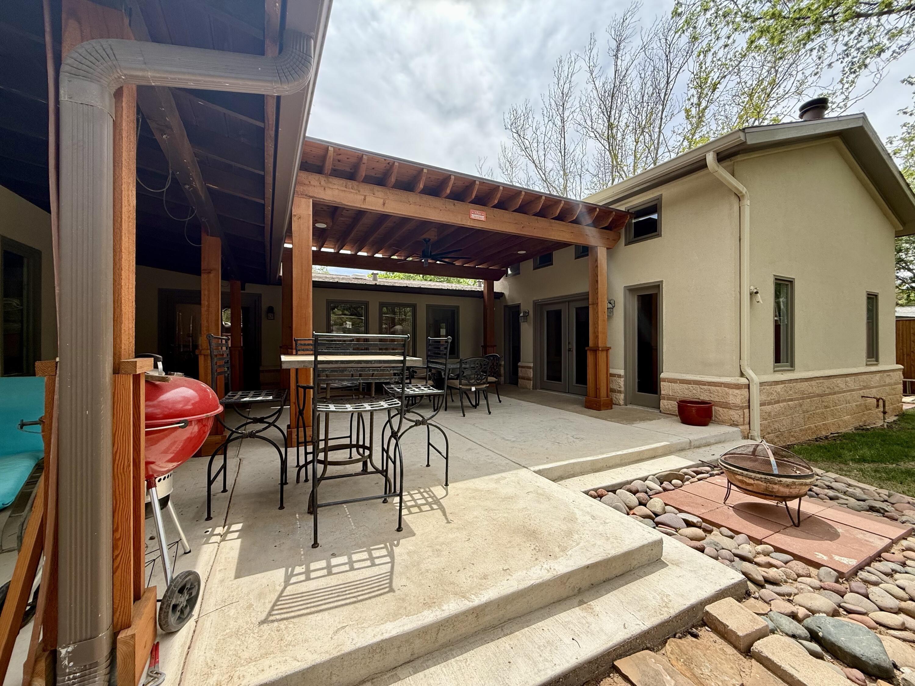 4406 15th Street Lubbock, TX 79416 - Photo 47 of 61 a view of a dinning tables and chair in the patio