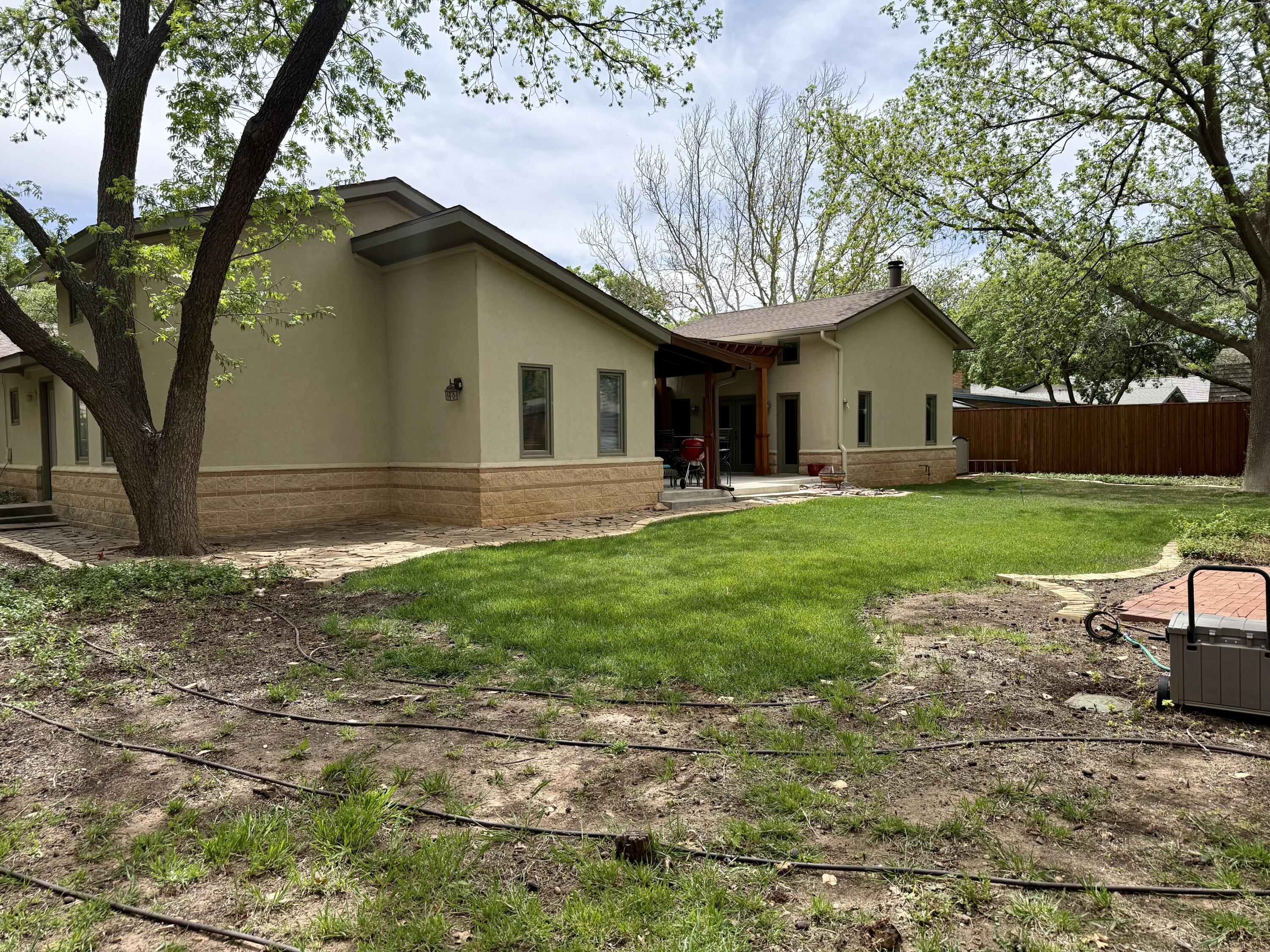 4406 15th Street Lubbock, TX 79416 - Photo 48 of 61 a front view of house with yard and green space