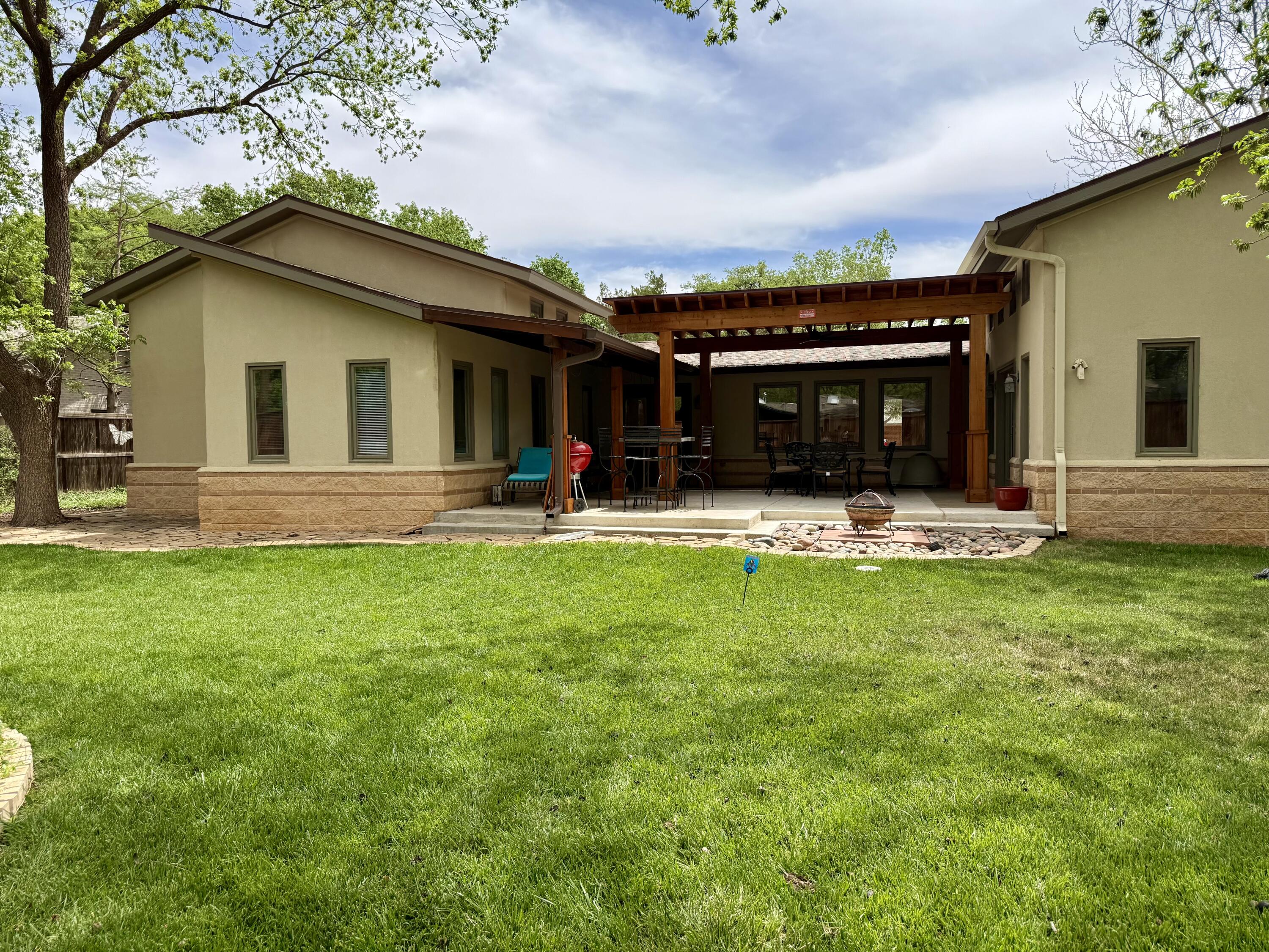 4406 15th Street Lubbock, TX 79416 - Photo 49 of 61 a front view of house with yard and outdoor seating