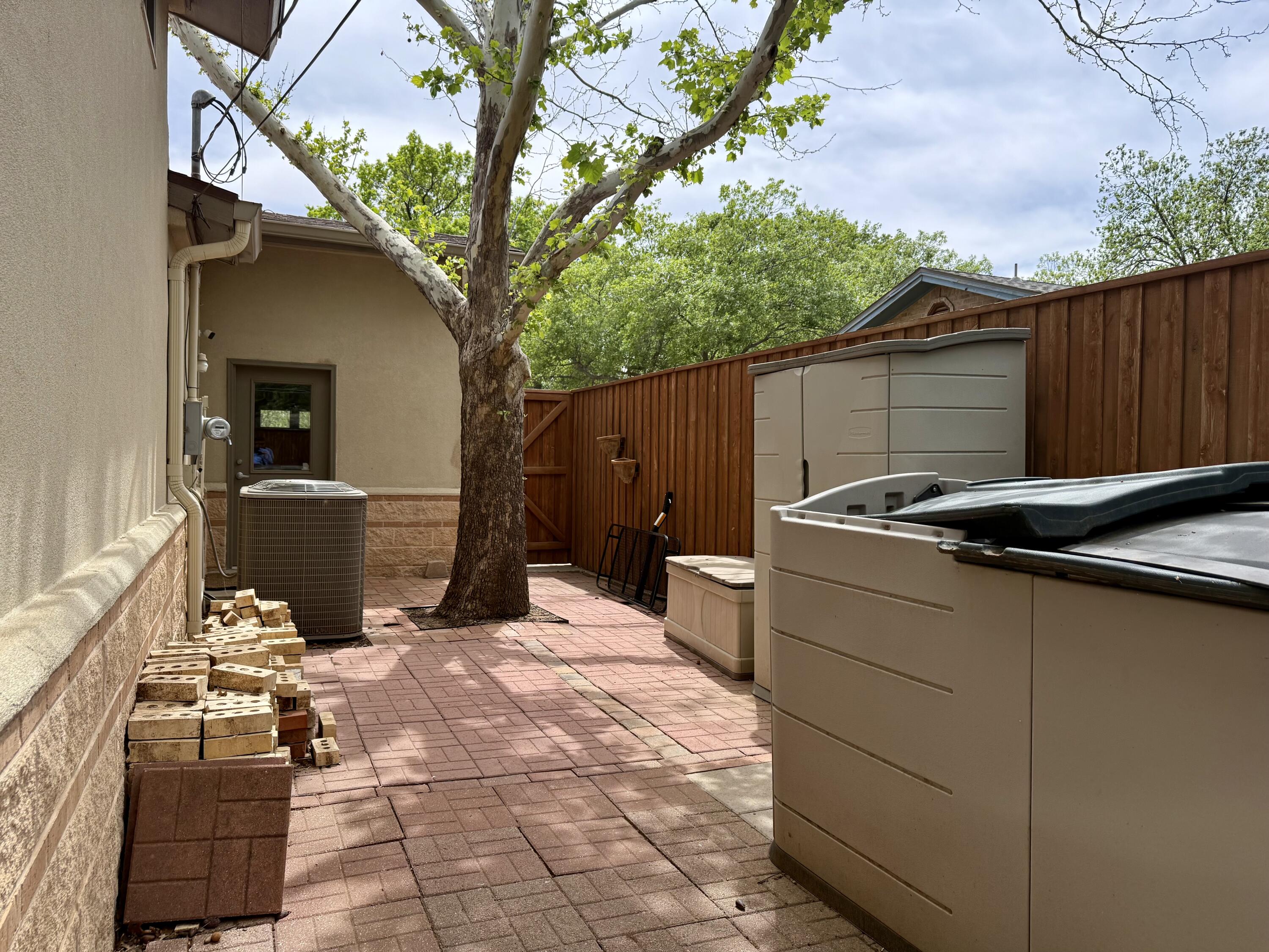 4406 15th Street Lubbock, TX 79416 - Photo 51 of 61 a view of a backyard with sitting area