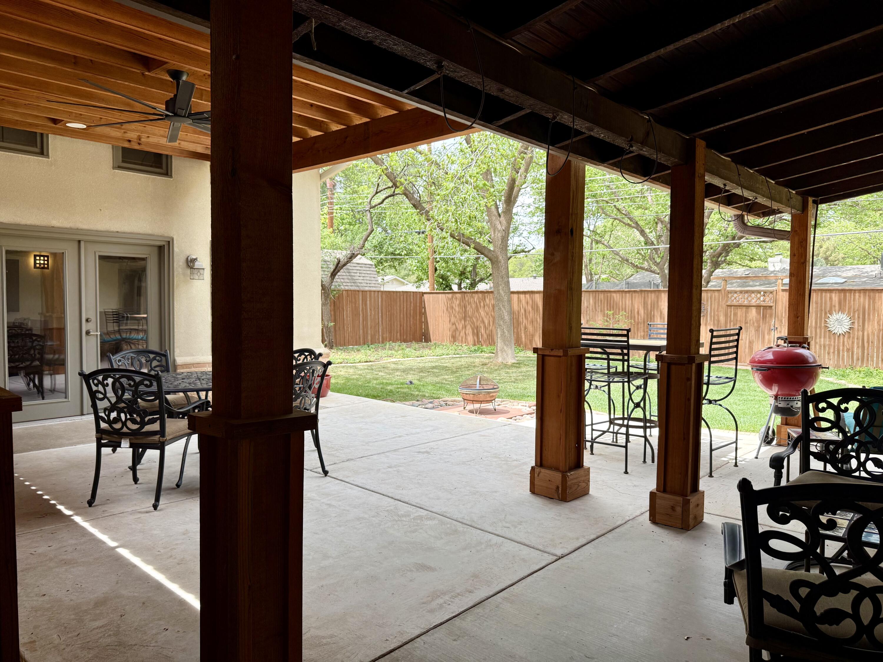 4406 15th Street Lubbock, TX 79416 - Photo 54 of 61 a view of porch with chairs and couches with wooden floor