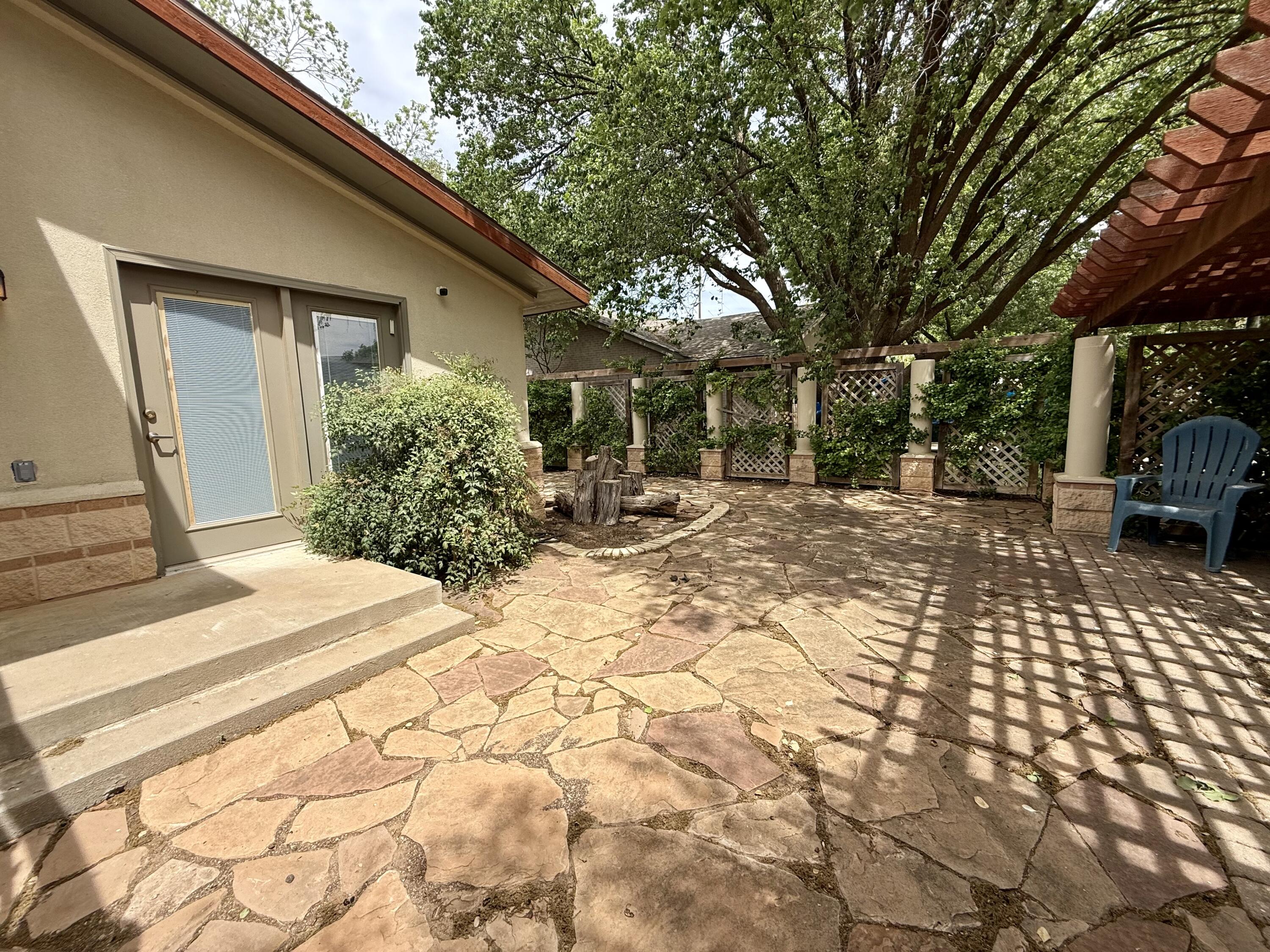 4406 15th Street Lubbock, TX 79416 - Photo 60 of 61 a view of a backyard with sitting area
