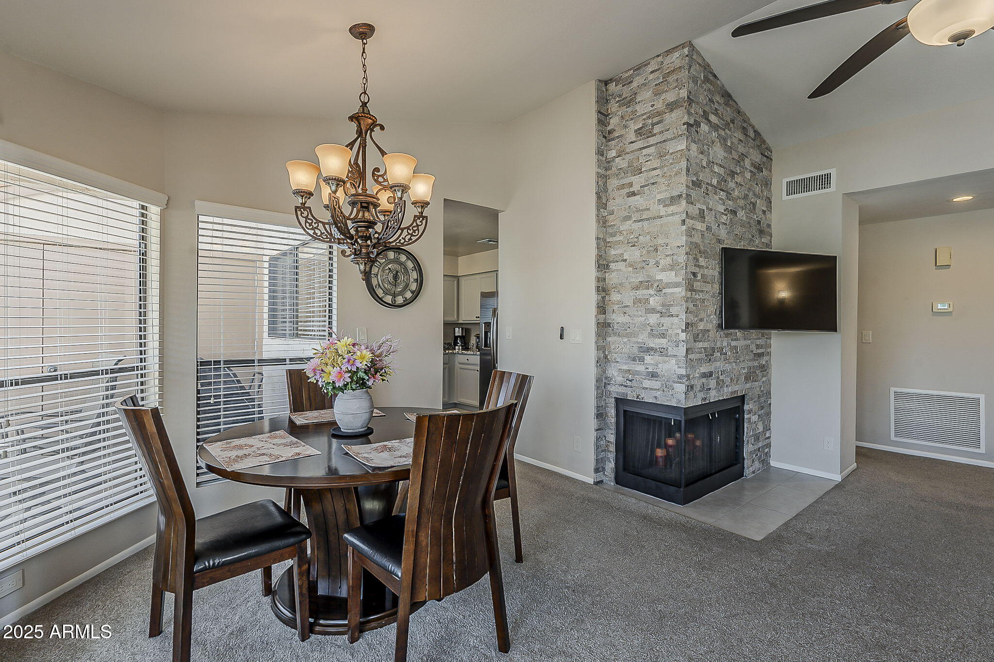 9707 East Mountain View Road, Unit 2412 Scottsdale, AZ 85258 - Photo 12 of 43 a dining room with furniture and window