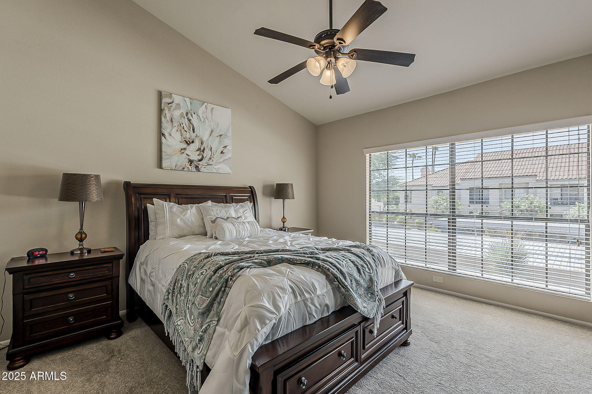 9707 East Mountain View Road, Unit 2412 Scottsdale, AZ 85258 - Photo 21 of 43 a bedroom with a large bed and a window