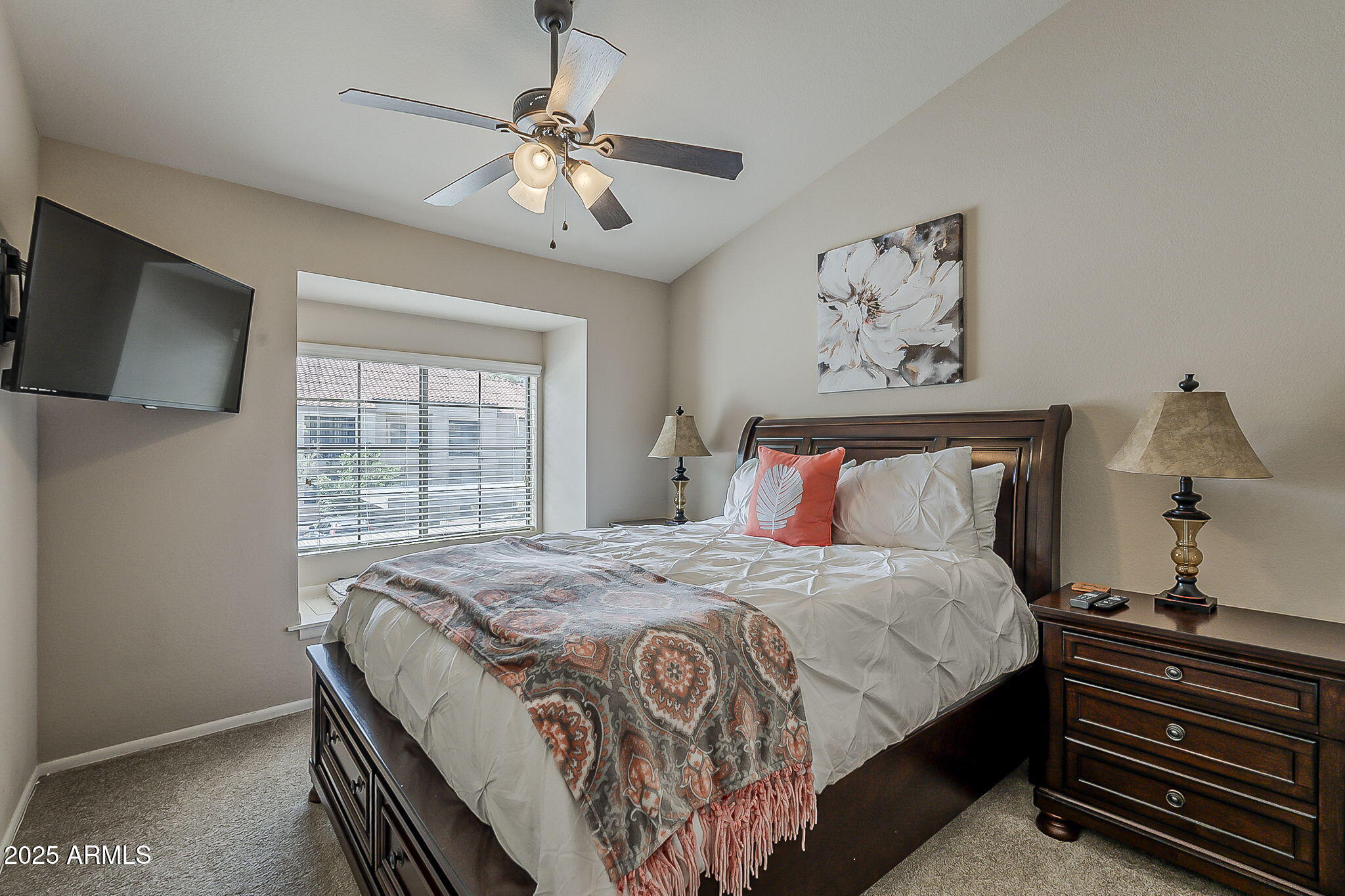 9707 East Mountain View Road, Unit 2412 Scottsdale, AZ 85258 - Photo 29 of 43 a bedroom with bed and window