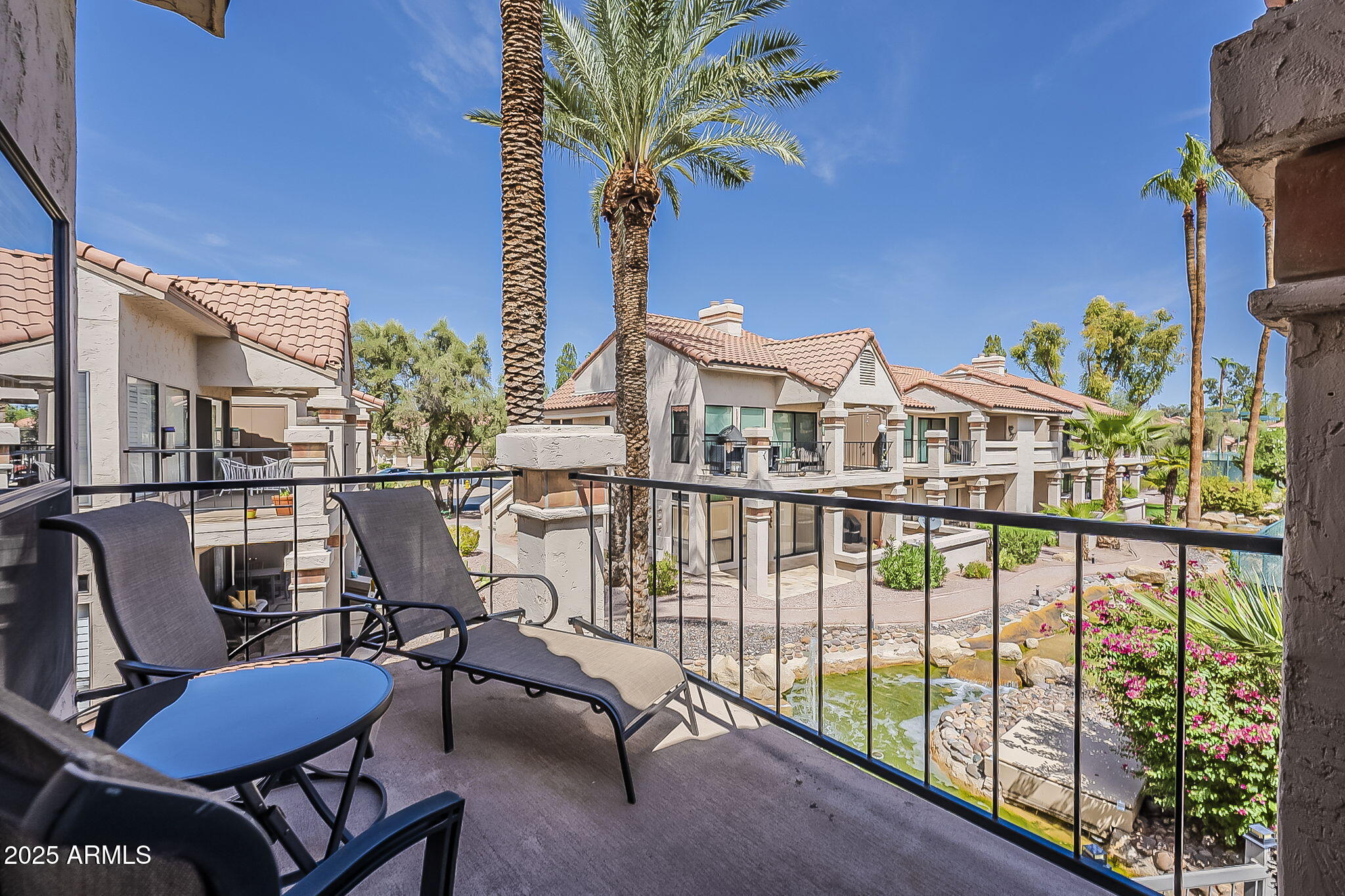 9707 East Mountain View Road, Unit 2412 Scottsdale, AZ 85258 - Photo 34 of 43 a view of a balcony with chairs
