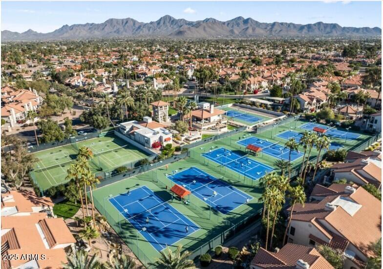 9707 East Mountain View Road, Unit 2412 Scottsdale, AZ 85258 - Photo 39 of 43 an aerial view of a city with lots of residential buildings ocean and mountain view in back