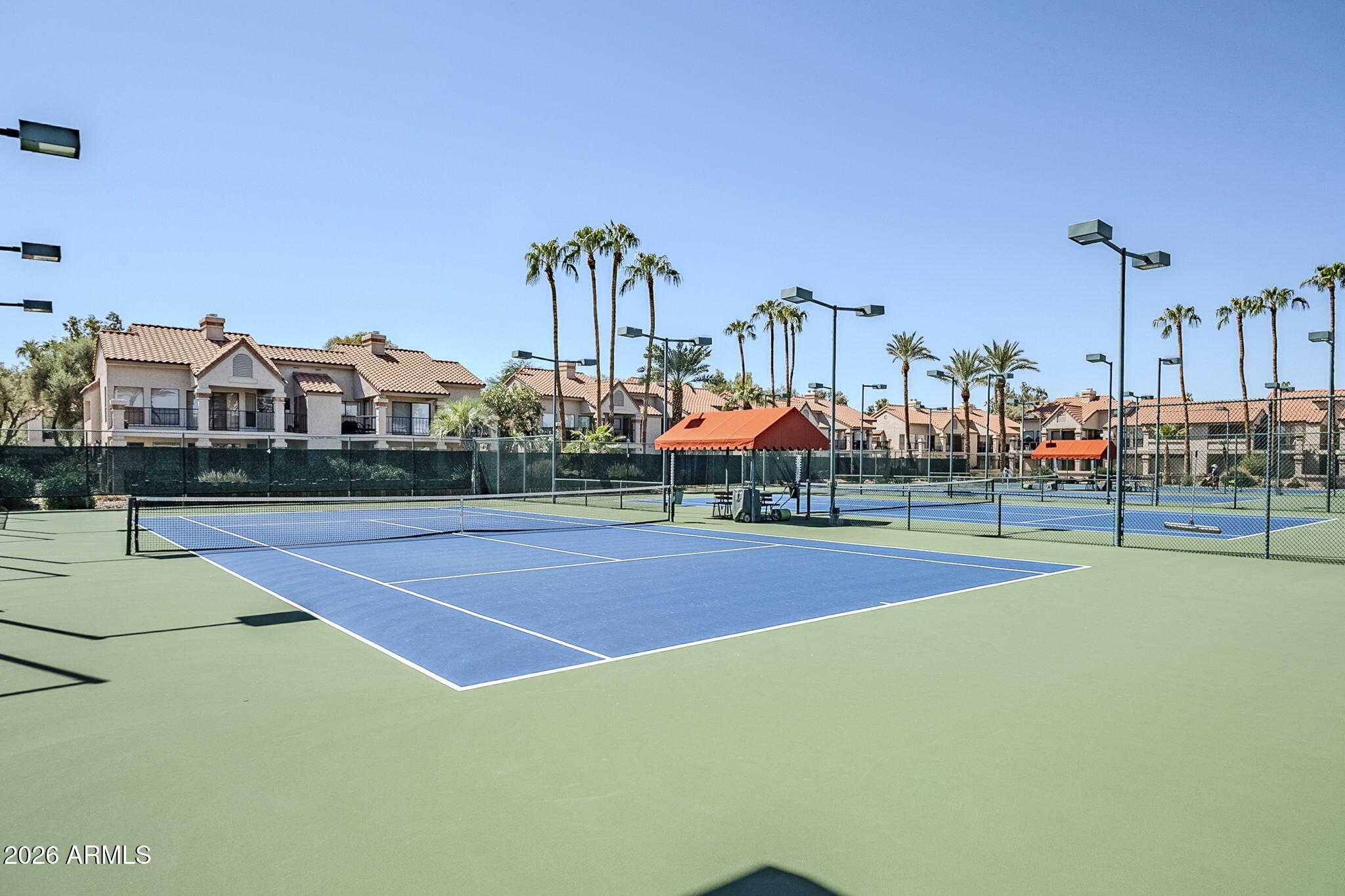 9707 East Mountain View Road, Unit 2412 Scottsdale, AZ 85258 - Photo 49 of 61 a view of an outdoor space and tennis court