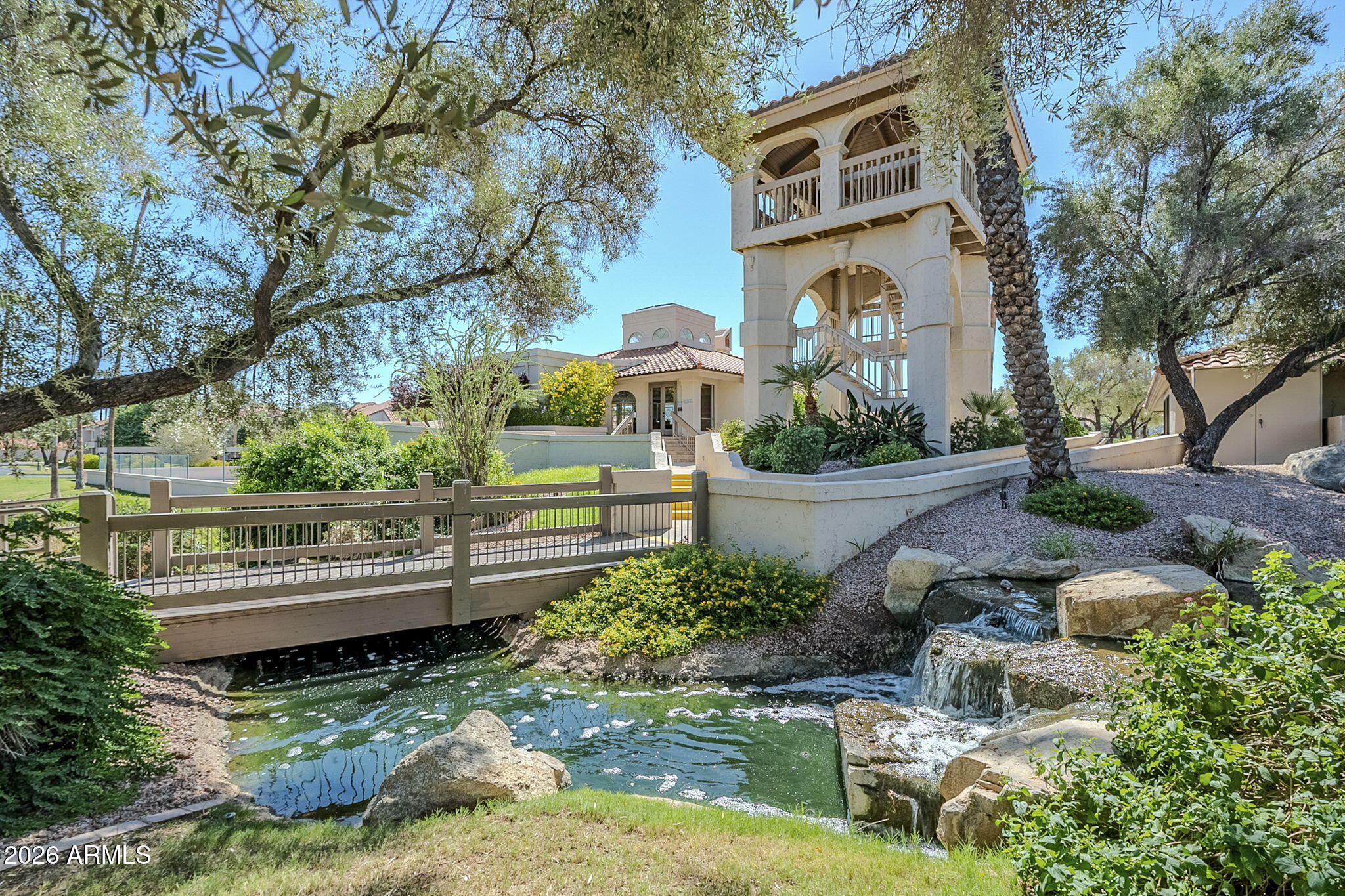 9707 East Mountain View Road, Unit 2412 Scottsdale, AZ 85258 - Photo 59 of 61 a front view of a house with garden