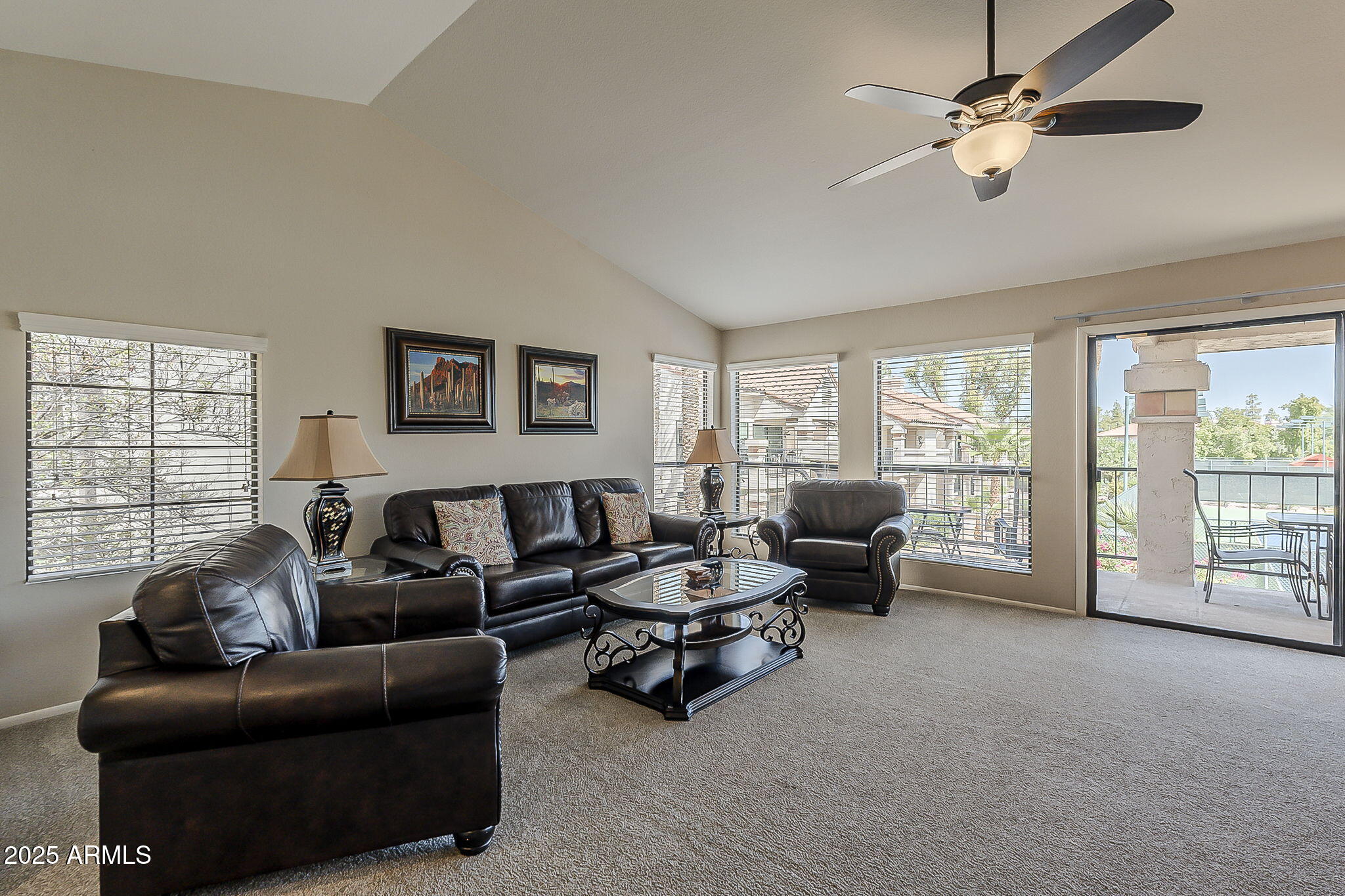 9707 East Mountain View Road, Unit 2412 Scottsdale, AZ 85258 - Photo 6 of 43 a living room with furniture and a large window