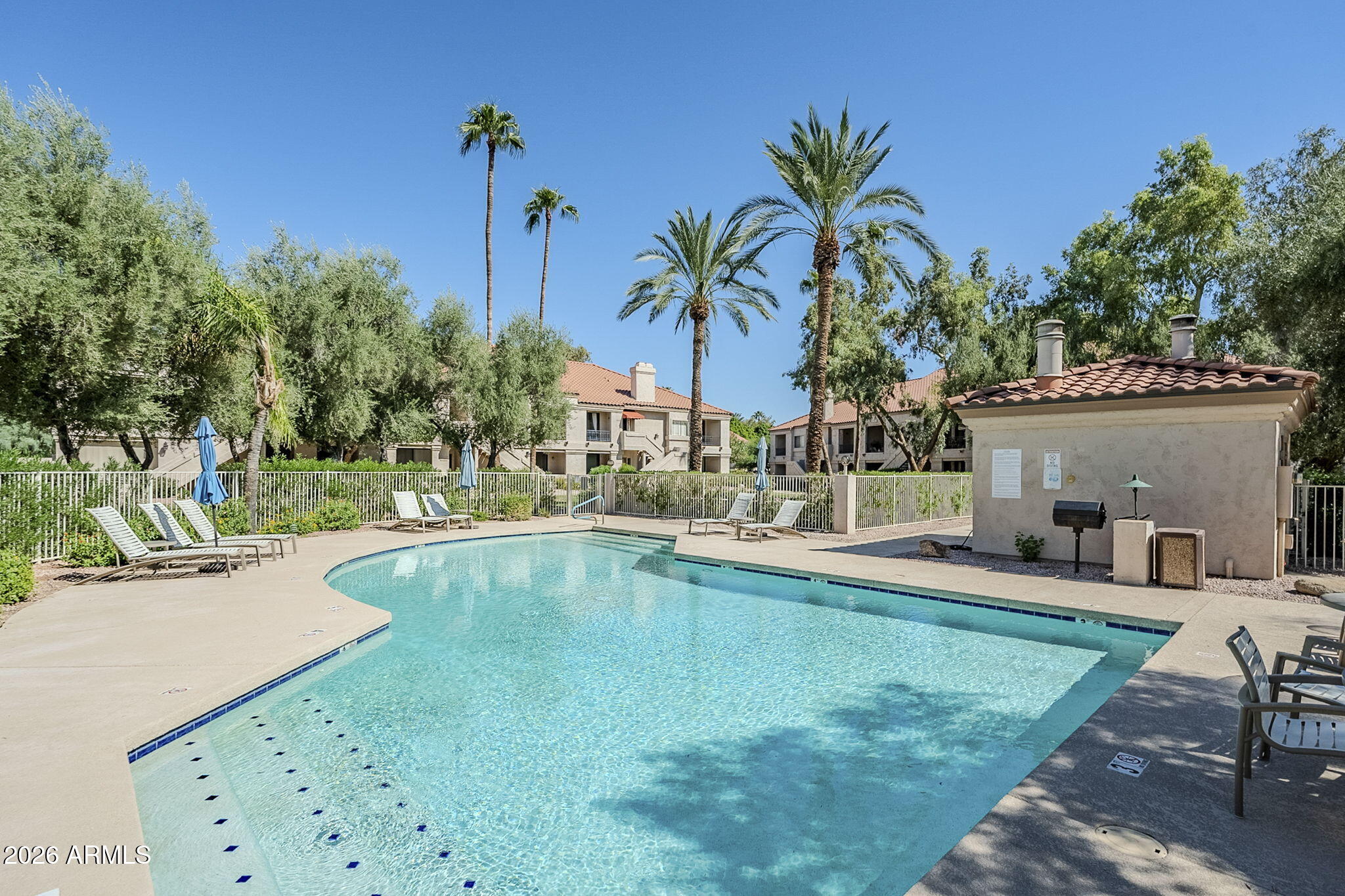 9707 East Mountain View Road, Unit 2412 Scottsdale, AZ 85258 - Photo 61 of 61 a view of a swimming pool with a patio