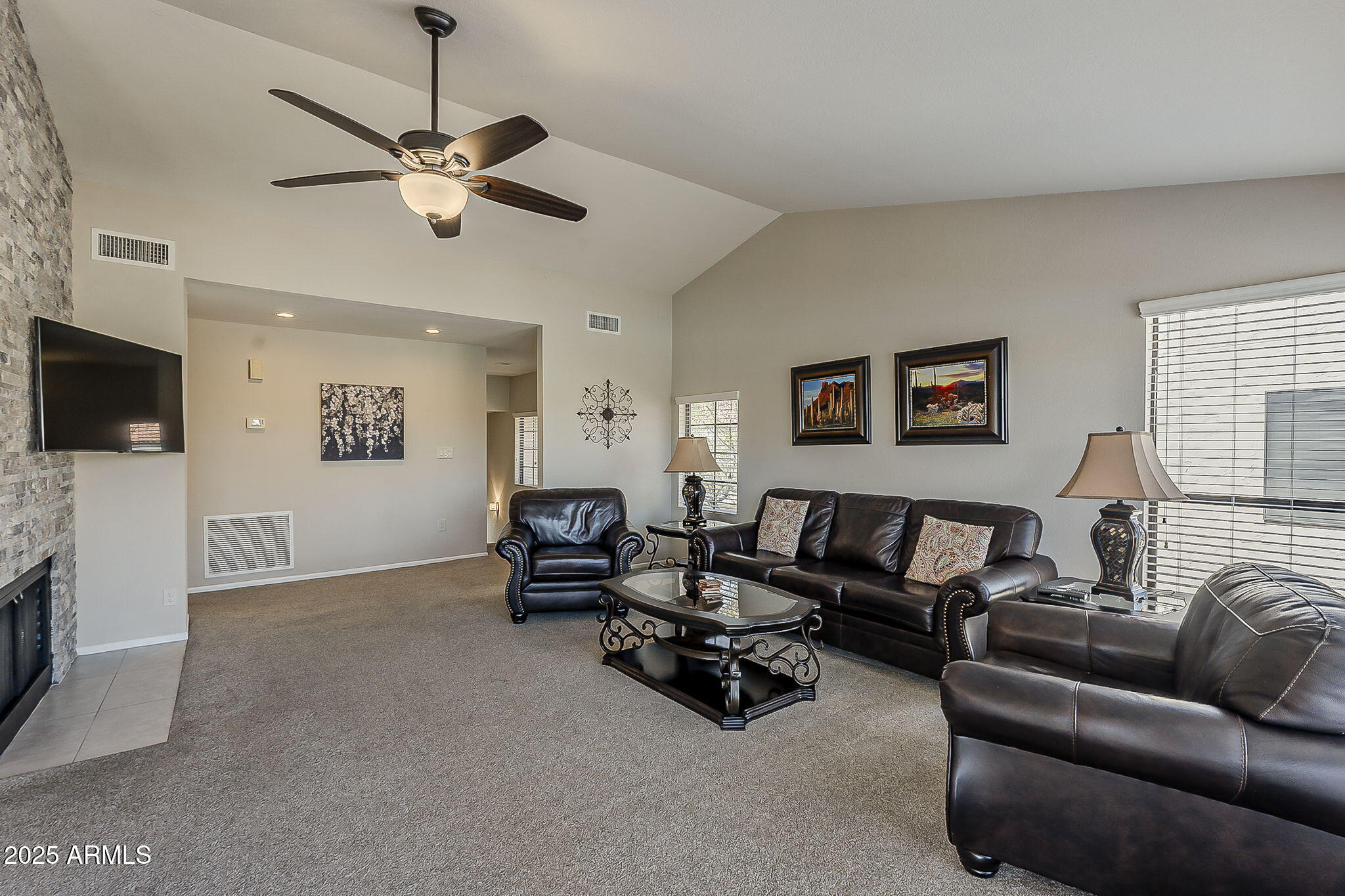 9707 East Mountain View Road, Unit 2412 Scottsdale, AZ 85258 - Photo 7 of 43 a living room with furniture and a flat screen tv