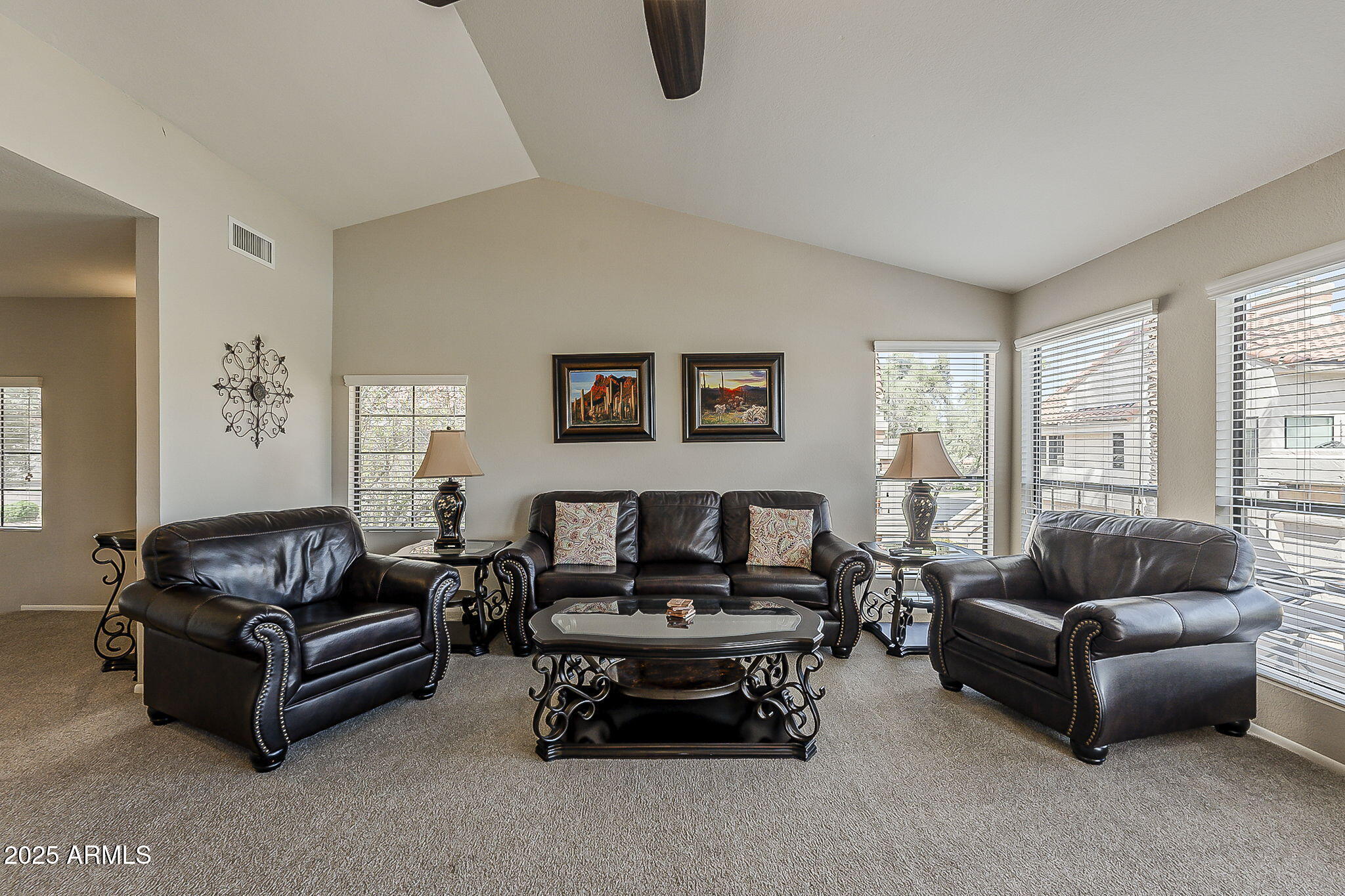 9707 East Mountain View Road, Unit 2412 Scottsdale, AZ 85258 - Photo 8 of 43 a living room with furniture and a large window