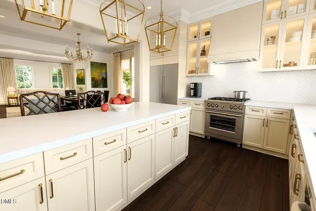 a kitchen with cabinets a sink and appliances