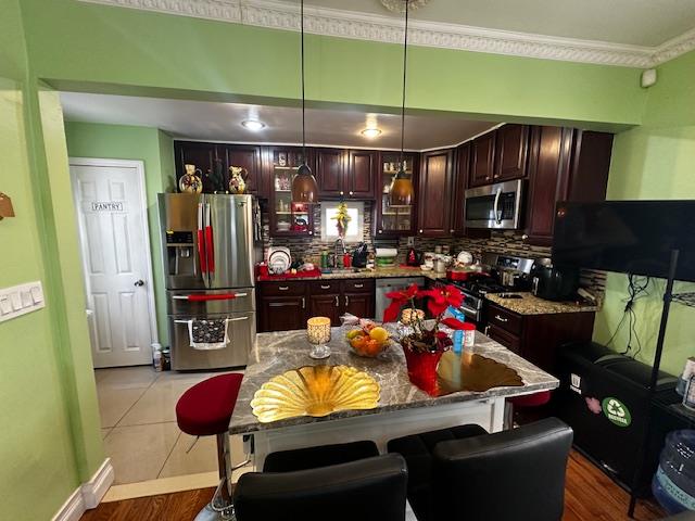 2335 Hermany Avenue Bronx, NY 10473 - Photo 12 of 23 a kitchen with stainless steel appliances kitchen island granite countertop a refrigerator stove and sink