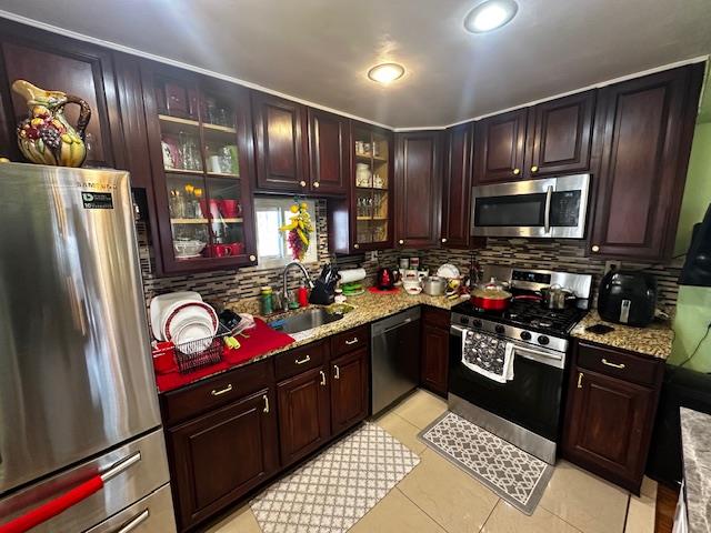 2335 Hermany Avenue Bronx, NY 10473 - Photo 13 of 23 a kitchen with granite countertop stainless steel appliances and wooden cabinets