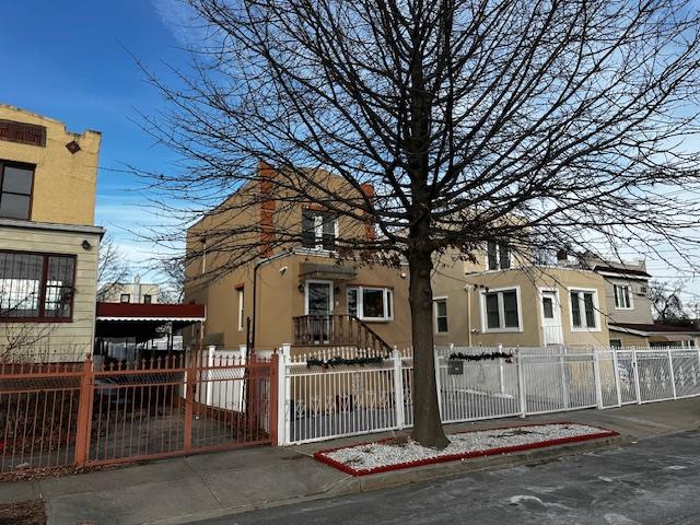 2335 Hermany Avenue Bronx, NY 10473 - Photo 2 of 23 a front view of a house with a tree