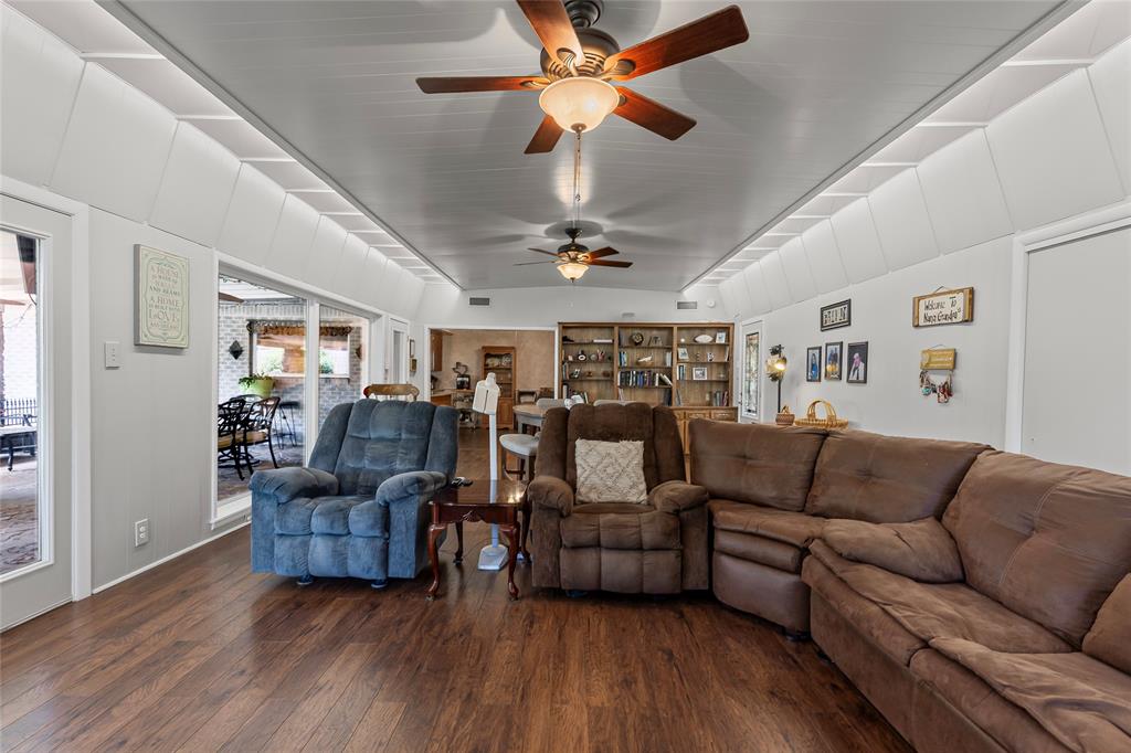 1302 Culver Street Commerce, TX 75428 - Photo 11 of 40 a living room with furniture and wooden floor