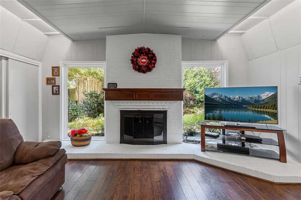 1302 Culver Street Commerce, TX 75428 - Photo 13 of 40 a living room with furniture fireplace and flat screen tv