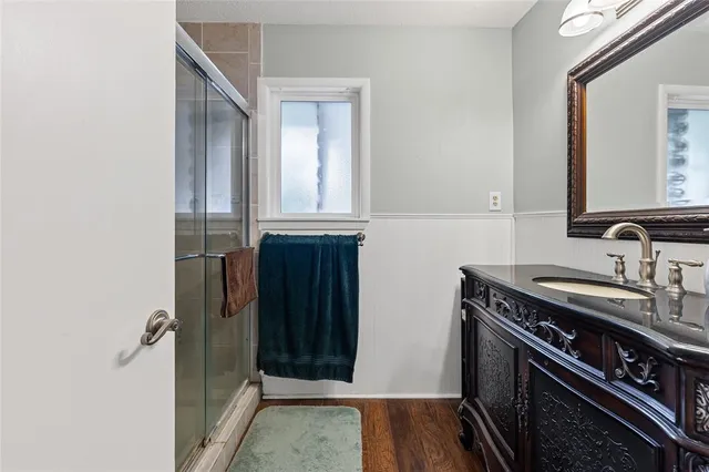 a view of a bathroom with a sink and a window