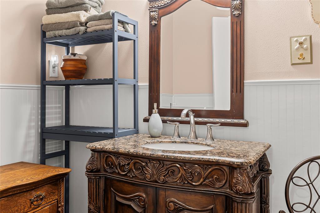 1302 Culver Street Commerce, TX 75428 - Photo 27 of 40 a kitchen with a stove and a sink