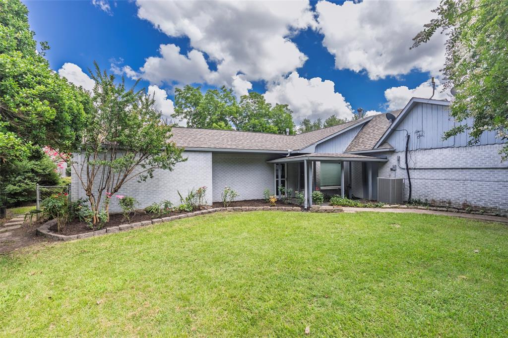 1302 Culver Street Commerce, TX 75428 - Photo 35 of 40 a front view of a house with a yard