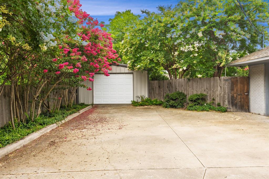 1302 Culver Street Commerce, TX 75428 - Photo 39 of 40 a front view of a house with a yard and tree