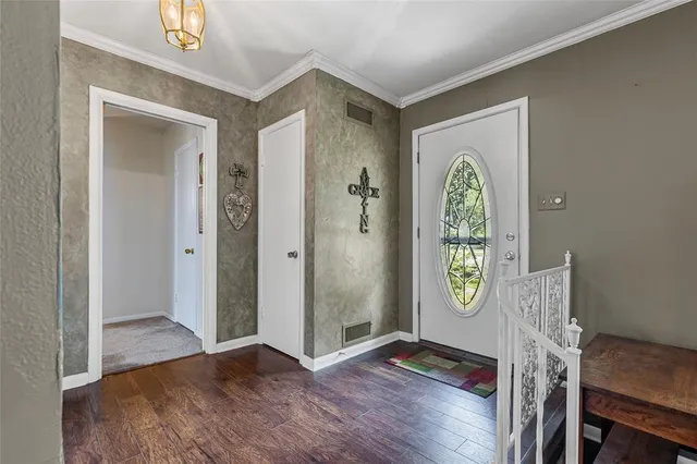a view of front door with wooden floor