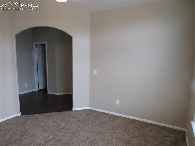 7334 Pearly Health Road Colorado Springs, CO 80908 - Photo 6 of 35 arched entry to front Living room