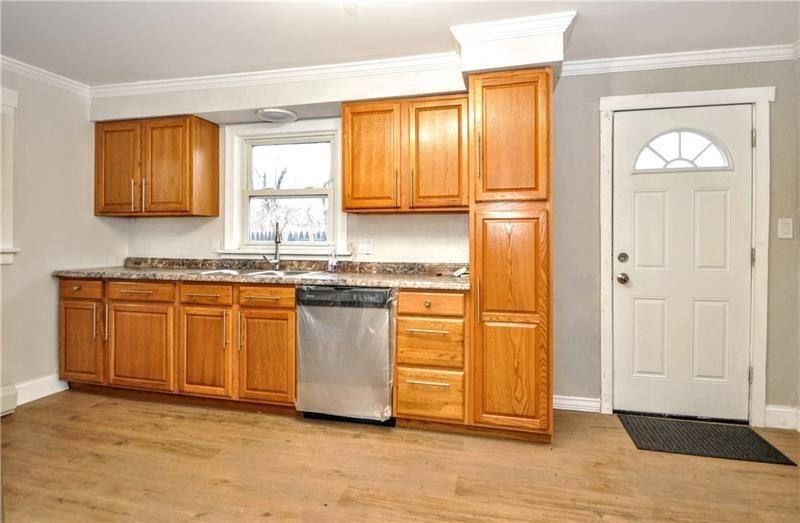 145 East Main Street Monongahela, PA 15063 - Photo 12 of 27 a kitchen with granite countertop wooden cabinets and a stainless steel appliances
