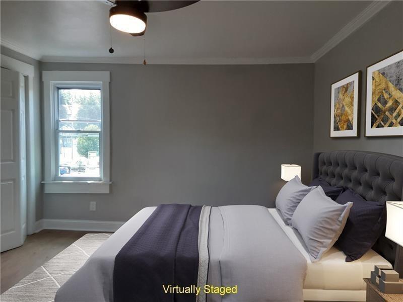145 East Main Street Monongahela, PA 15063 - Photo 15 of 27 a bed sitting in a bedroom next to a window