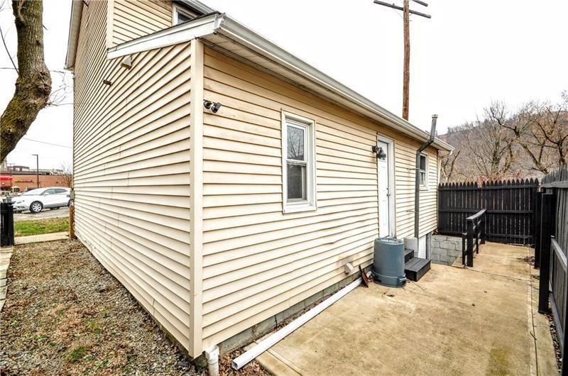 145 East Main Street Monongahela, PA 15063 - Photo 2 of 27 a view of a patio with a table and chairs and iron floor