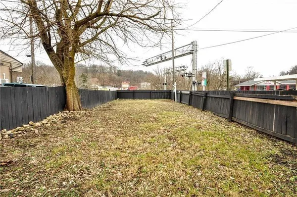 a view of a back yard of the house