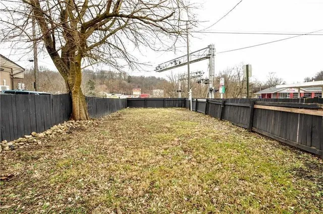 a view of a back yard of the house