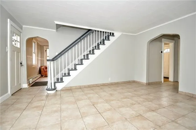 a view of an empty room with stairs