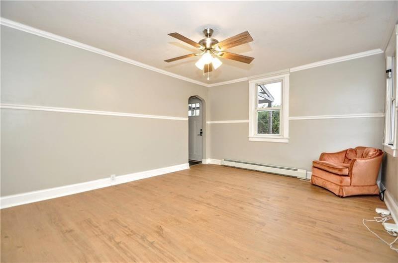 145 East Main Street Monongahela, PA 15063 - Photo 10 of 27 an empty room with windows and ceiling fan