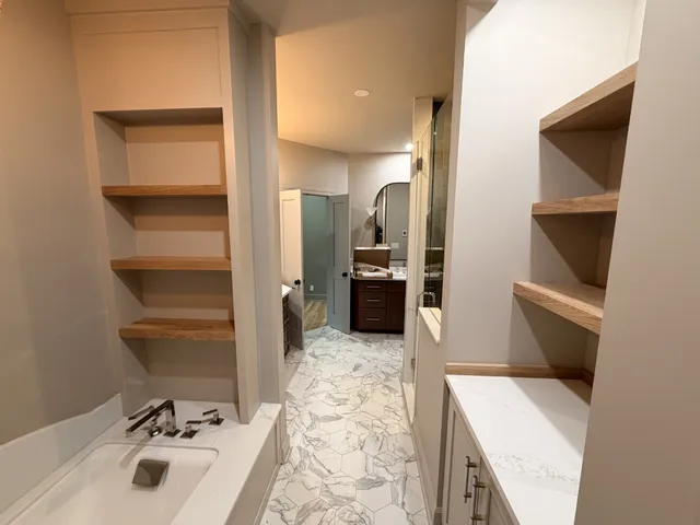 a view of a room with wooden floor