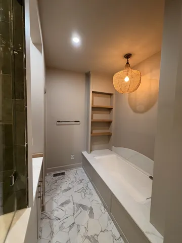 a kitchen with a sink and a wooden floor