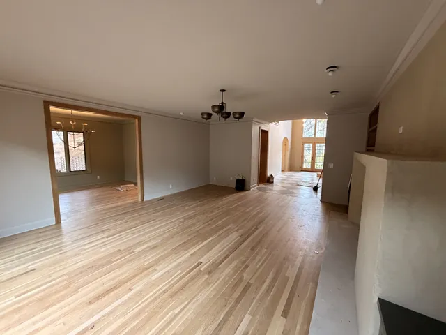 a bathroom with a sink a light fixture and a mirror