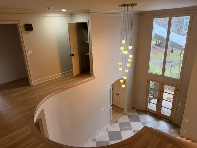 a view of entryway with a rug and a floor