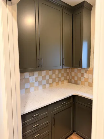 a kitchen with stainless steel appliances granite countertop a sink a stove and a wooden floors