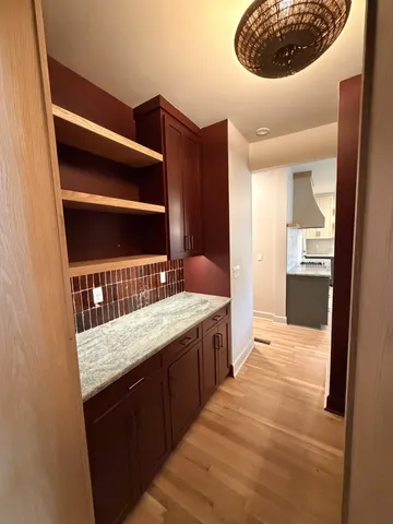 a bathroom with a sink vanity and a mirror
